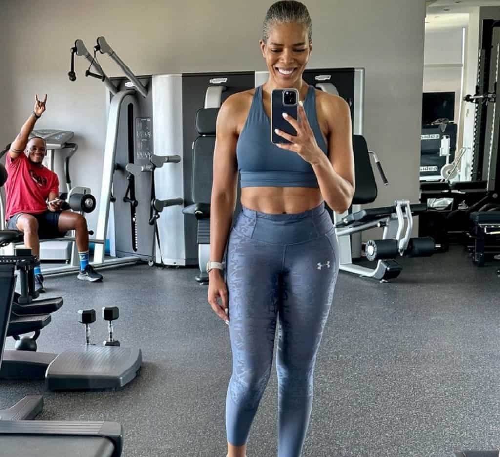 Connie Ferguson working in the gym with her friend.