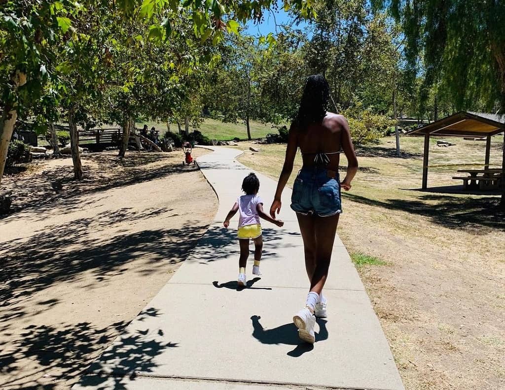 Xosha takes a walk with her daughter.